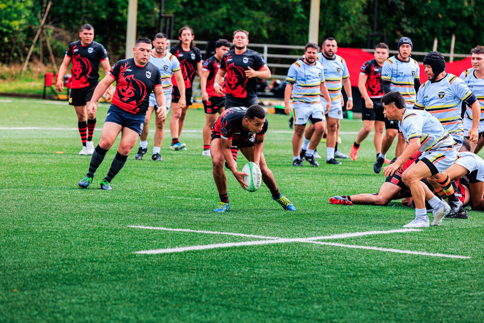 Rugby player scoring a try, grounding the ball